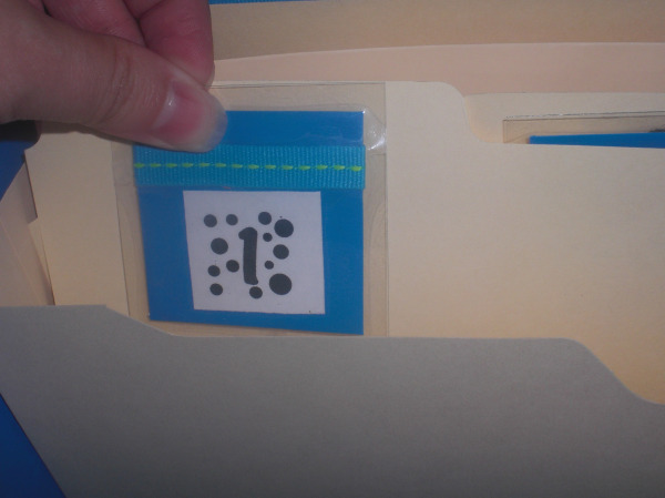 Each number attaches to a manila folder.